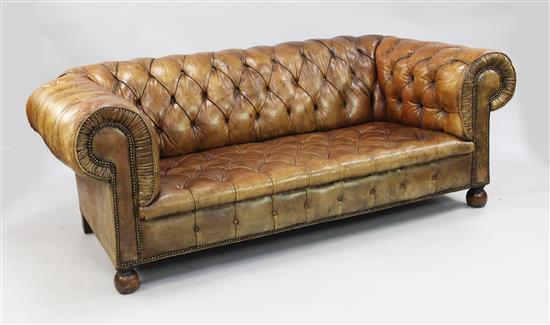 A brown leather buttoned Chesterfield settee, W.6ft 6in.